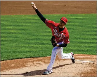  ?? AARON DOSTER / ASSOCIATED PRESS ?? New Reds pitcher Jeff Hoffman allowed one earned run on three hits in five innings Sunday as Cincinnati beat the St. Louis Cardinals 12-1 in the third game of the season.