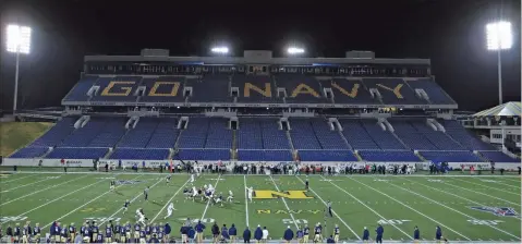  ?? Patrick Smith/Getty Images North America/TNS ?? In this file photo, seating is empty as the Memphis Tigers play against the Navy Midshipmen during the first half at Navy-Marine Corps Memorial Stadium on November 28, 2020 in Annapolis, Maryland. Due to the Covid-19 pandemic, Navy athletics announced they would not allow general admission fans, only a limited number of midshipmen.