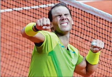  ?? JEAN-FRANCOIS BADIAS/AP PHOTO ?? Spain’s Rafael Nadal celebrates after defeating Norway’s Casper Ruud in their final match of the French Open on Sunday at the Roland Garros stadium in Paris. Nadal won 6-3, 6-3, 6-0.