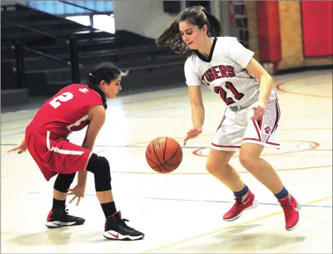  ?? Photo by Ernest A. Brown ?? Tolman senior guard Ally Larson (right) scored a team-high 16 points Friday afternoon against East Providence, but Townie guard Courtney Dorr made six 3-pointers to finish with a game-high 29 points in the Townies’ 60-44 Division II triumph at...