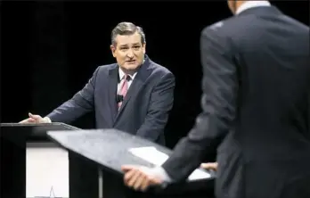  ?? Tom Fox, pool/Getty Images ?? Sen. Ted Cruz, R-Texas, turns toward Rep. Beto O'Rourke, D-Texas, to make a point during a debate at Southern Methodist University on Friday in Dallas.