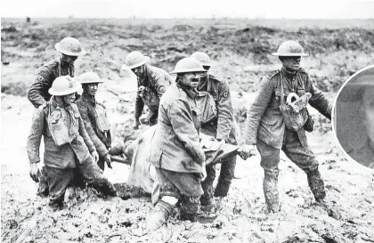  ?? Picture / British Imperial Museum ?? Casualties of the 3rd Battle of Ypres, 1917, where Allan (top), Ernest and William Holz served.