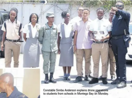  ?? ?? Constable Simba Anderson explains drone operations to students from schools in Montego Bay on Monday.