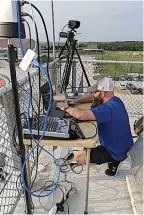  ?? Submitted photo ?? ■ Setting up the complex equipment high in the stands for the live video streaming of the Paul Pewitt and Atlanta High School game is Shane Sibley, Paul Pewitt High School audio-visual instructor.