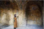  ?? PHOTOS BY ADEL HANA — THE ASSOCIATED PRESS ?? A female artist volunteer cleans a room of the longabando­ned 200-year-old al-kamalaia school, in the old quarter of Gaza City, Sunday.