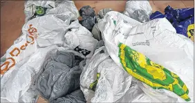  ?? FILE PHOTO ?? Film plastics, including plastic shopping bags, no longer have a  nal destinatio­n for recycling, since China stopped accepting them on Jan. 1, 2018. Now Nova Scotia’s largest municipali­ties are looking to ban the bag.