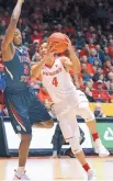  ?? JIM THOMPSON/JOURNAL FILE ?? UNM’s Elijah Brown (4) has averaged 20.3 points in his career against Fresno State with Tim Williams in the Lobos’ lineup.