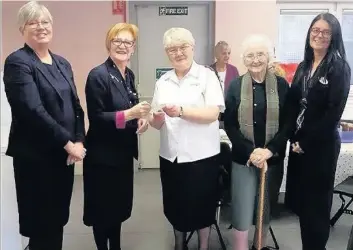  ??  ?? Helping hand Specsavers practice co-owner Ann Beaton with Salvation Army captain Mary Boyd, club member Betty Dewar and Specsavers deputy manager Jade Eaglesham