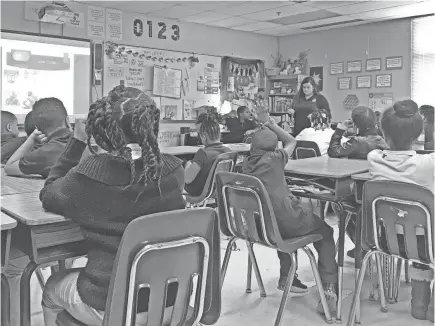  ?? ARIKA HERRON/USA TODAY NETWORK ?? Katie Millikan’s third-grade class at Avondale Meadows Academy in Indianapol­is is learning about the history of slavery in the United States. When emotions run high, the class takes a break. “It helps,” one student says.