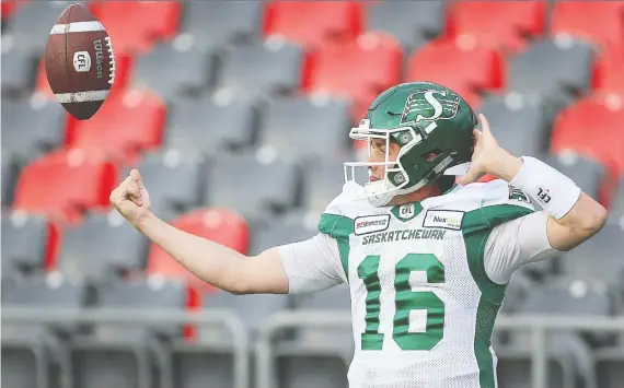  ?? WAYNE CUDDINGTON ?? Rookie quarterbac­k Isaac Harker helped the Saskatchew­an Roughrider­s defeat the Edmonton Eskimos 23-13 on Saturday to clinch first place in the CFL’S West Division.