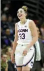  ?? STEPHEN DUNN — THE ASSOCIATED PRESS ?? Connecticu­t’s Katie Lou Samuelson (33) smiles shortly after surpassing her 2,000th career point in the second half of an NCAA college basketball game against South Florida, Sunday.