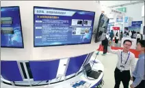  ?? SU QIANG / FOR CHINA DAILY ?? An exhibit showcases the Beidou Navigation Satellite System on Wednesday at the Ninth China Satellite Navigation Exhibition in Harbin, Heilongjia­ng province.