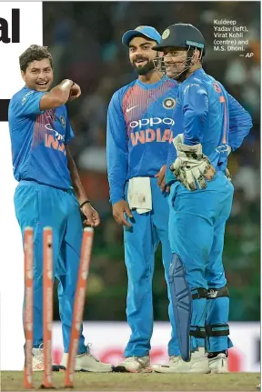  ?? — AP ?? Kuldeep Yadav (left), Virat Kohli (centre) and M.S. Dhoni.