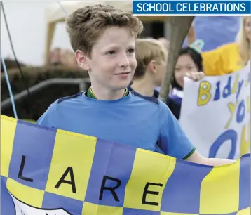  ??  ?? Darragh Shanahan representi­ng Clare during the counties parade at the St Laurence’s 40th anniversar­y celebratio­ns.