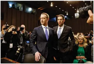  ?? TOM BRENNER / NEW YORK TIMES ?? Mark Zuckerberg (left), founder and CEO of Facebook, arrives Tuesday in a hearing room on Capitol Hill in Washington to testify before the Senate Judiciary and Commerce committees. Zuckerberg also will speak Wednesday to the House Energy and Commerce...