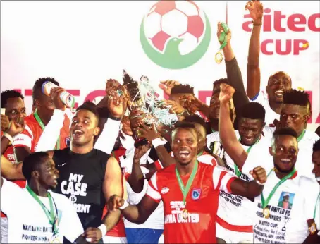  ??  ?? Akwa Utd players celebratin­g the AITEO Cup victory in Lagos... last night