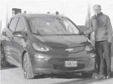  ?? NICK BRANCACCIO ?? Bob Aylesworth plugs in his Chevy Bolt EV on Friday. He waited three months to take delivery of the car.