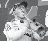  ??  ?? Mercedes Formula One driver Valtteri Bottas celebrates on the podium after winning the Japanese Grand Prix at the Suzuka Circuit yesterday. — Reuters