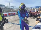  ?? JENNA FRYER AP ?? Jimmie Johnson prepares for practice at Long Beach with a glove over a splint on his right hand.