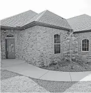  ?? [PHOTO BY STEVE GOOCH, THE OKLAHOMAN] ?? Carr Quality Homes built this new house at 7120 NW 152 in Deer Valley Estates addition.