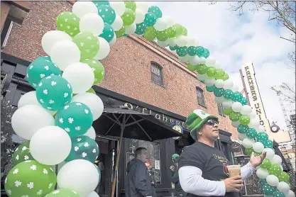  ?? LIPO CHING – STAFF PHOTOGRAPH­ER ?? Ronnie Trujillo, right, is in charge of security outside O’Flaherty’s Irish Pub on St. Patrick’s Day in San Jose on Saturday.