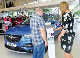  ??  ?? Spec check GO Vauxhall’s Ella Harvey runs our man through car’s kit