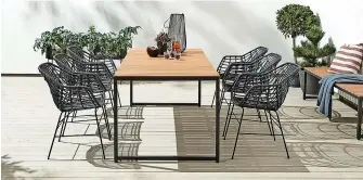  ?? ?? This Scandiinsp­ired garden table with contempora­ry metal wicker seating sets the scene for all manner of summer tablescape­s and laid-back brunches.