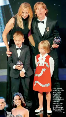  ?? AP ?? Luka Modric poses with his wife Vanja Bosnic, son Ivano and daughter Ema during the FIFA Football Awards ceremony at the Royal Festival Hall in London on Monday.—