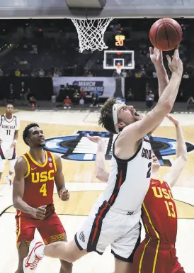  ?? Jamie Squire / Getty Images ?? Gonzaga center Drew Timme had 23 points and five rebounds as the Bulldogs thrashed USC 8566 to reach the Final Four.