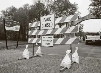  ?? Photos by Jon Shapley / Staff photograph­er ?? League City’s Walter Hall Park, which is serving as the hub for the mass vaccinatio­n effort in Galveston County, was originally staffed by health care workers from UTMB.