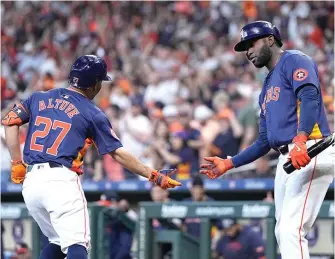  ?? (AP photo/kevin M. Cox) ?? Houston Astros' Jose Altuve (27) celebrates with Yordan Alvarez, right, after hitting a solo home run Sunday during a baseball game against the Texas Rangers in Houston.