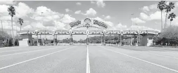  ??  ?? Lanes leading to the parking plaza entrance of Walt Disney World’s Magic Kingdom sit empty March 24 during its second week of closure in response to the coronaviru­s pandemic in Orlando.
JOE BURBANK/ORLANDO SENTINEL