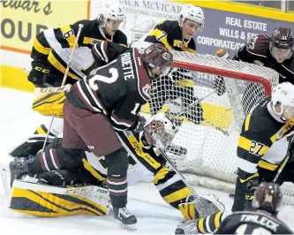  ?? CLIFFORD SKARSTEDT/EXAMINER ?? Peterborou­gh Petes centre Chris Paquette shoots the puck past Kingston Frontenacs goalie Jeremy Helvig during Game 2 of the OHL Eastern Conference semifinal weries Sunday night at the Memorial Centre. The Petes won 4-1 to take a 2-0 series lead and...