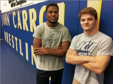  ?? MARK PODOLSKI — THE NEWS-HERALD ?? John Carroll wrestlers Blake Dixon of Brush, left, and Jarrad Lasko of Madison have qualified for the March 9-10 NCAA Division III wrestling tournament in Cleveland.