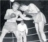  ?? AP ?? From a 1949 fight, Jake LaMotta, left, pounds Marcel Cerdan in third round of a world middleweig­ht title bout in Detroit. LaMotta won the title by a knockout in the 10th round.
