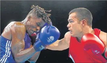  ??  ?? Vikas Krishan (Red) is the only Indian male boxer to win an Asian Games and a Commonweal­th Games gold medal.