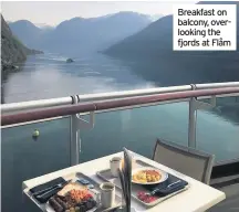  ??  ?? Breakfast on balcony, overlookin­g the fjords at Flåm