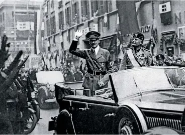  ??  ?? BEFORE THE STORM Hitler and Mussolini getting a warm welcome in Rome in 1938. During Pius XII’S pontificat­e, more than 8,000 Jews from Italy were killed in Nazi death camps.