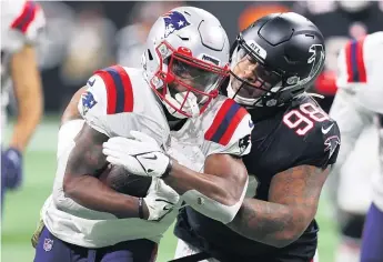  ?? KEVIN C. COX/GETTY IMAGES ?? Nose tackle Mike Pennel (right) played in 10 games last season with the Falcons.