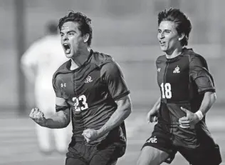  ?? Photos by Ronald Cortes / Contributo­r ?? Reagan senior forward Andre Huereca, left, celebrates his second goal during Friday’s Region IV-6A quarterfin­al victory over Smithson Valley at Pieper High School.