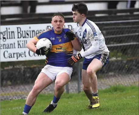  ??  ?? Darragh Roche, Glenflesk holding off the challenge of Oisín Moran, St Mary’s in the Kerry County Castleisla­nd Mart Intermedia­te Club Championsh­ip semi-final at JP O’Sullivan Park, Killorglin on Saturday Photo by Michelle Cooper Galvin