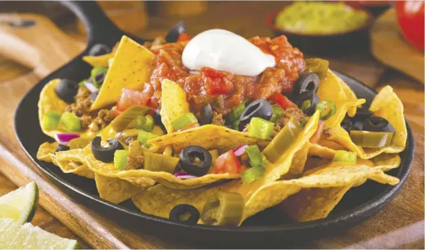  ?? GETTY IMAGES ?? Almost nothing is better than a pile of fried tortillas smothered in cheese, meat and vegetables. This popular yearly event, hosted by the SouthWest Edmonton Seniors Associatio­n, will bring seniors together for an afternoon of camaraderi­e and, of course, nachos.