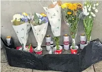  ??  ?? Floral tributes to Gyula Remes lie outside Parliament