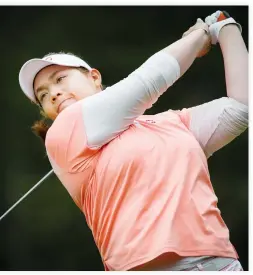  ??  ?? SHOT: Thailand's Ariya Jutanugarn watches her tee shot on the second hole during the third round of the LPGA Canadian Open tournament in Priddis, Alberta, Saturday. (AP)