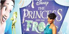  ??  ?? In this file photo actress Anika Noni Rose, the voice of Princess Tiana (at left on the poster), poses as she arrives for the world premiere screening of Disney’s “The Princess and The Frog.”—AFP