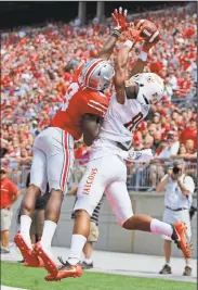  ?? AP PHOTO ?? Ohio State cornerback Gareon Conley, left, knocks the ball away from Bowling Green wide receiver Deric Phouthavon­g during the first half of the game Saturday in Columbus, Ohio.