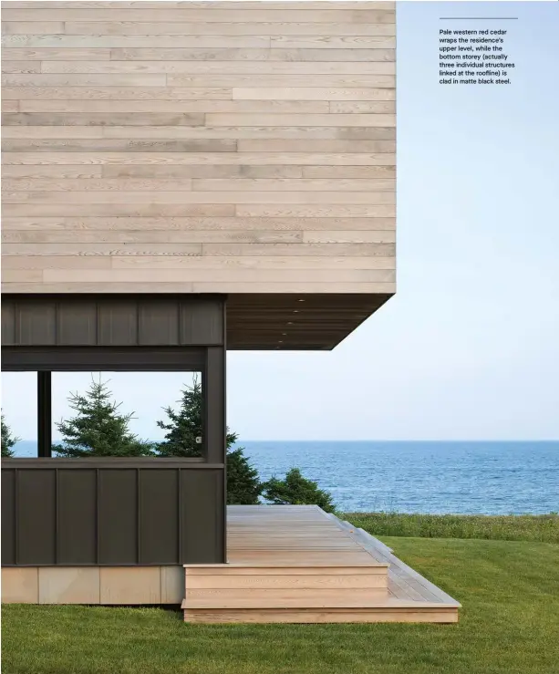  ??  ?? Pale western red cedar wraps the residence’s upper level, while the bottom storey (actually three individual structures linked at the roofline) is clad in matte black steel.