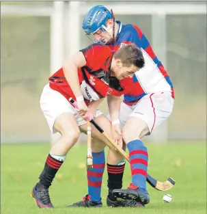  ?? Photo: Neil Paterson ?? Kingussie’s Robert Mabon and Glenurquha­rt’s Conor Golabek in a tussle for the ball during last Saturday’s Premieship encounter at Drumnadroc­hit which the red and blacks won 3-1.