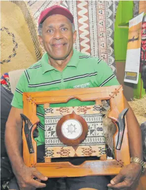 ?? Photo: SUPPLIED ?? Recipient of the COVID-19 Concession­al Loan Package for Micro, Small and Medium Enterprise­s, 63-year-old, Kata Bogiono, poses with a frame at his handicraft business at the Suva Handicraft Centre.