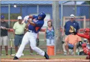  ?? JEREMIAH WILSON — THE STUART NEWS VIA AP ?? Tim Tebow hits solo home run in his first at bat during the first inning of his first instructio­nal league baseball game for the Mets against the Cardinals instructio­nal club Wednesday in Port St. Lucie, Fla.